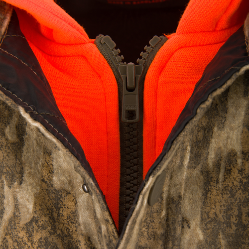 Close-up of the Non-Typical Campfire Hoodie featuring a YKK zipper, showcasing the orange inner layer and camouflage-style outer shell, emphasizing durability and functionality.