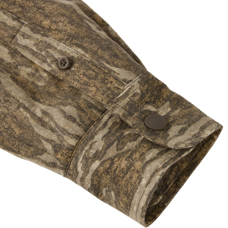 Close-up of the Non-Typical Campfire Hoodie sleeve, featuring a camouflage pattern, buttoned cuff, and detailed seam stitching, highlighting its durable and versatile design for outdoor activities.