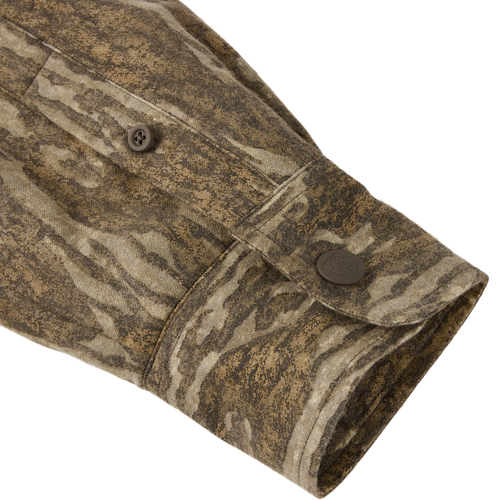 Close-up of the Non-Typical Campfire Hoodie sleeve, featuring a camouflage pattern, buttoned cuff, and detailed seam stitching, highlighting its durable and versatile design for outdoor activities.