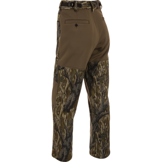 Non-Typical Endurance Pant with Scent Control, featuring olive-brown softshell top, tree-bark camouflage lower legs, reinforced knees, adjustable waist, and pockets for hunting versatility.