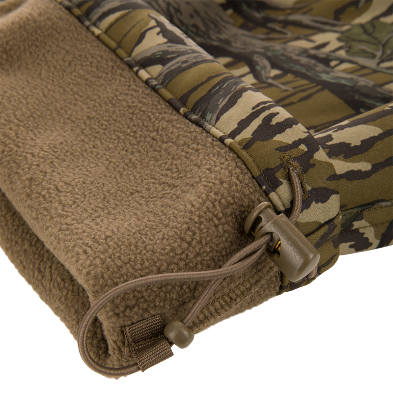 Non-Typical Endurance Pant with Scent Control featuring a camouflage shell, fleece lining, and elastic drawcord for adjustable fit, ideal for mid-season hunting.