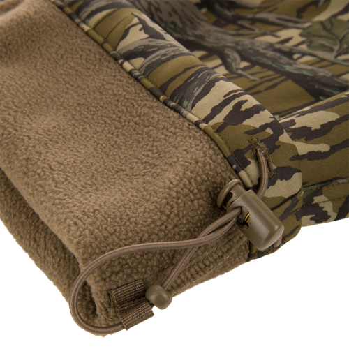 Non-Typical Endurance Pant with Scent Control featuring a camouflage shell, fleece lining, and elastic drawcord for adjustable fit, ideal for mid-season hunting.
