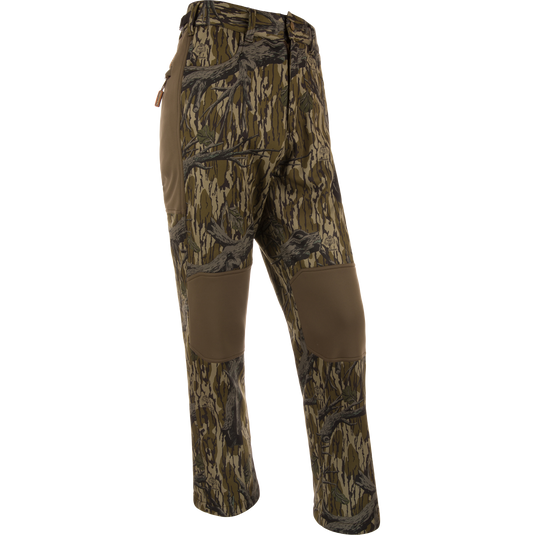 Non-Typical Endurance Pant with Scent Control on mannequin, featuring camouflage pattern, reinforced knees, zip fly, adjustable waist, and multiple pockets, ideal for mid-season hunting.