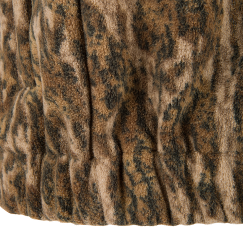 Close-up of the Non-Typical Windproof Layering Vest's elasticized hem, showcasing its plush, textured sherpa-style fleece fabric designed for warmth and outdoor durability.