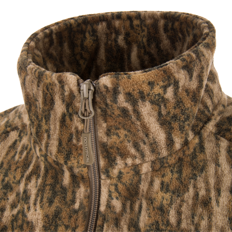 Close-up of the Non-Typical Windproof Layering Vest's high fleece collar and branded zipper, highlighting its windproof and water-resistant features for outdoor activities.