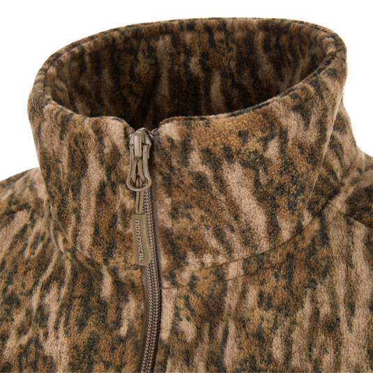 Close-up of the Non-Typical Windproof Layering Vest's high fleece collar and branded zipper, highlighting its windproof and water-resistant features for outdoor activities.