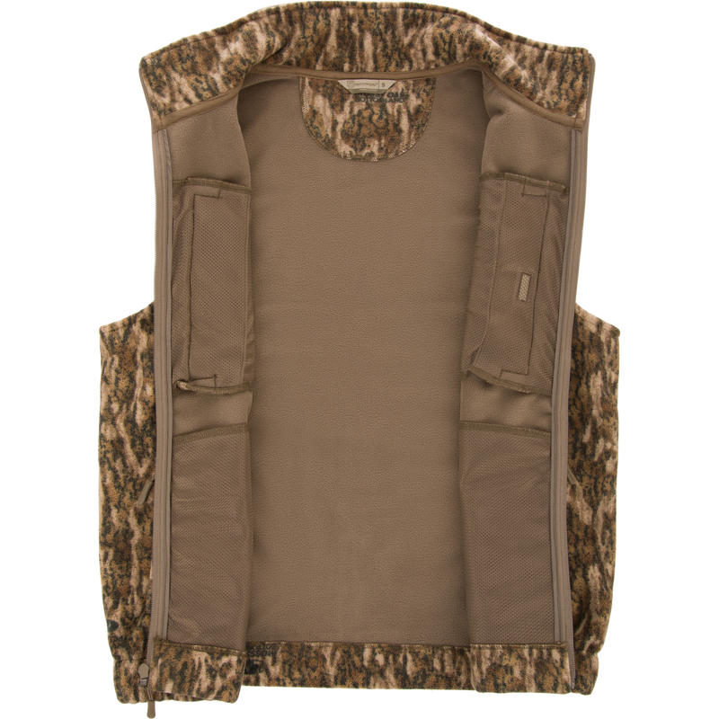 Non-Typical Windproof Layering Vest with a camouflage fleece shell, tan lining, and built-in mesh pockets, ideal for hunting and outdoor activities.