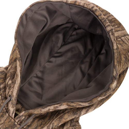 Close-up of Non-Typical Back Eddy Embossed Hoodie showing its zippered kangaroo pocket and adjustable drawstring hood, highlighting its detailed fabric texture.