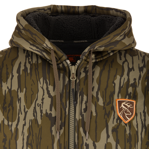 Non-Typical Silencer Full Zip Hoodie, camouflage with drawstring hood, fleece-lined, embroidered deer patch, metal zipper, ideal for hunting with warmth and quietness.