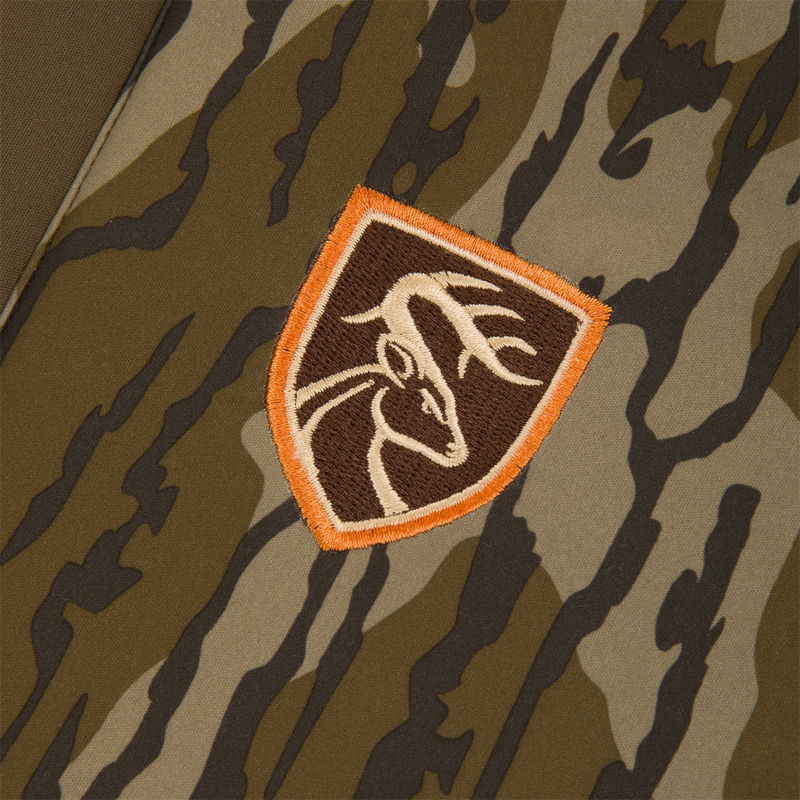 Youth Endurance Full Zip Jacket with Hood features a woodland camouflage pattern and a deer patch, perfect for versatile outdoor activities.