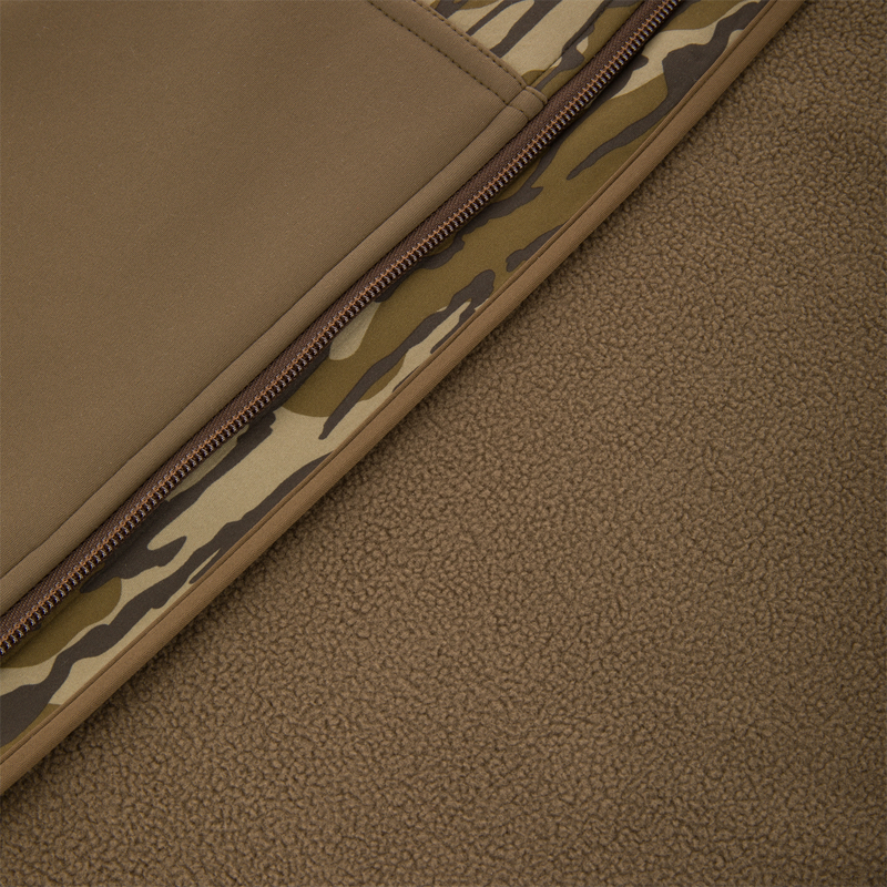 Youth Endurance Full Zip Jacket with Hood featuring fleece lining, camouflage trim, and a durable zipper, ideal for outdoor activities and scent control.