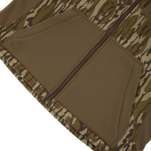 Youth Endurance Full Zip Jacket with Hood features a camo print, central zipper, and angled kangaroo-style pockets, ideal for outdoor activities with scent control technology.