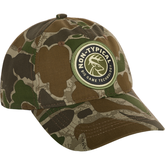 A close-up of the Big Game Technology Patch Camo Twill Cap, featuring a camouflage hat with a logo patch.