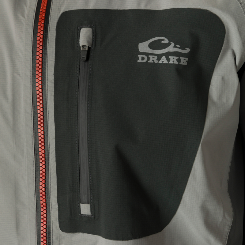 Ultra-Lite Backwaters Waterproof Stretch Jacket, featuring a close-up of the Vislon center front zipper and reflective logos, highlighting its waterproof and breathable design.