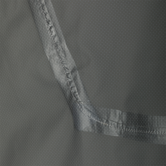 Close-up of the Ultra-Lite Backwaters Waterproof Stretch Jacket's grey fabric, highlighting its 2.5-layer ripstop material, designed for waterproof and breathable performance.