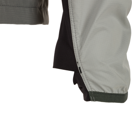 Close-up of the Ultra-Lite Backwaters Waterproof Stretch Jacket sleeve, showcasing its lightweight ripstop fabric and ergonomic design for outdoor enthusiasts.