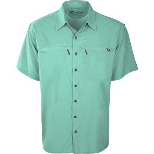 Close-up of the Drake Town Lake Short Sleeve Shirt, featuring a lightweight, breathable polyester fabric, button-up design, and two horizontal zipper pockets.