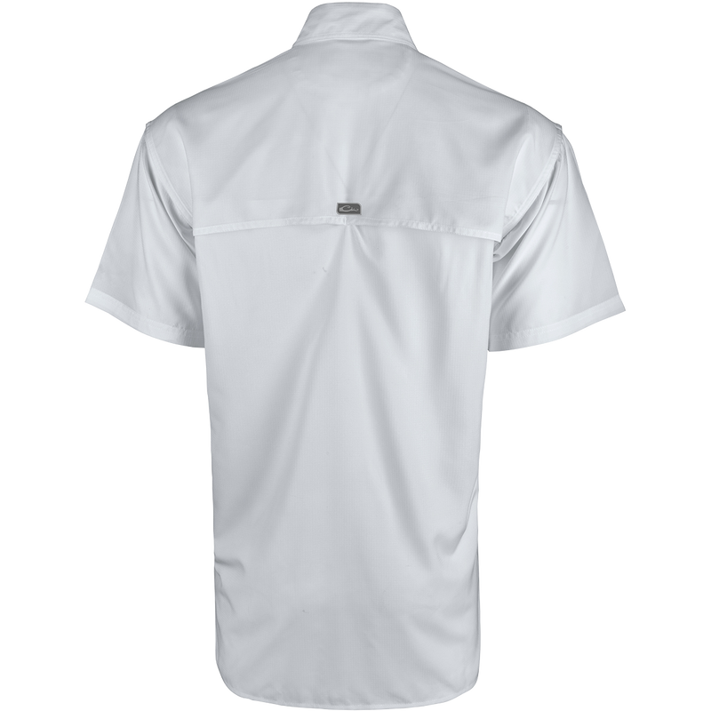 A lightweight, stretchy Town Lake Shirt S/S made from 100% textured polyester. Features UPF 30 sun protection, moisture-wicking technology, vented cape back, mechanical stretch fabric, and 2 horizontal zipper pockets.