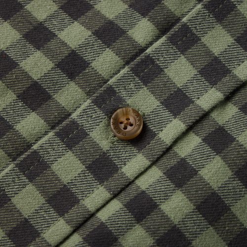 Close-up of the Drake Autumn Flannel Shirt, showcasing the green and dark buffalo-check pattern, buttoned placket, and embossed button detail.