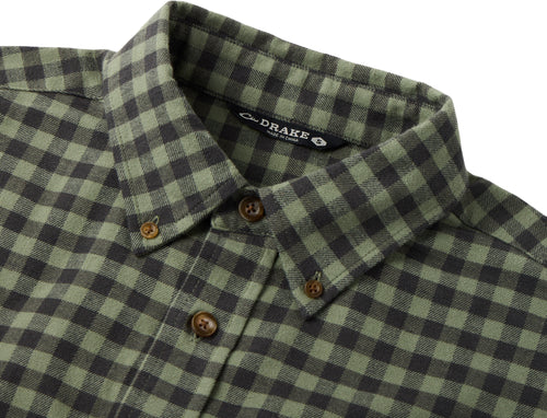 Close-up of the Drake Autumn Flannel Shirt, showcasing a green and black checkered pattern, button-down collar, and visible “Drake” label, emphasizing its casual outdoor style.