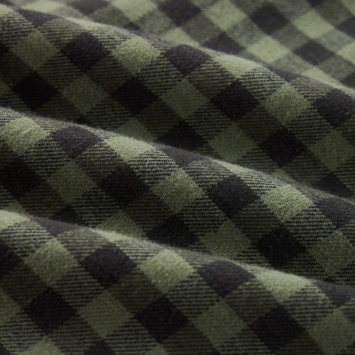 Autumn Flannel Shirt with a green and dark checkered pattern, soft folds, featuring a button-down collar, chest pocket, and sculpted hem for versatile wear.