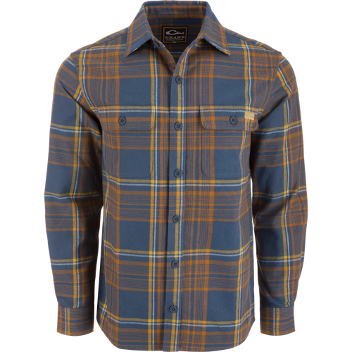 Legacy Flannel Plaid Shirt on mannequin, featuring button-front closure, two chest pockets, and button cuffs, ideal for layering in cool, outdoor settings.