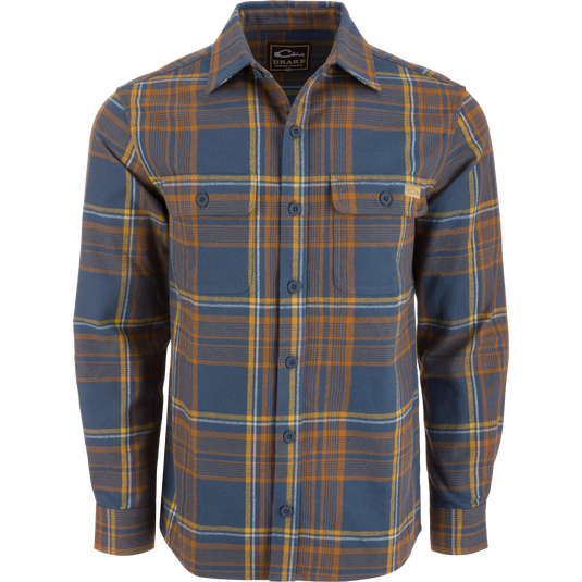 Legacy Flannel Plaid Shirt on mannequin, featuring button-front closure, two chest pockets, and button cuffs, ideal for layering in cool, outdoor settings.