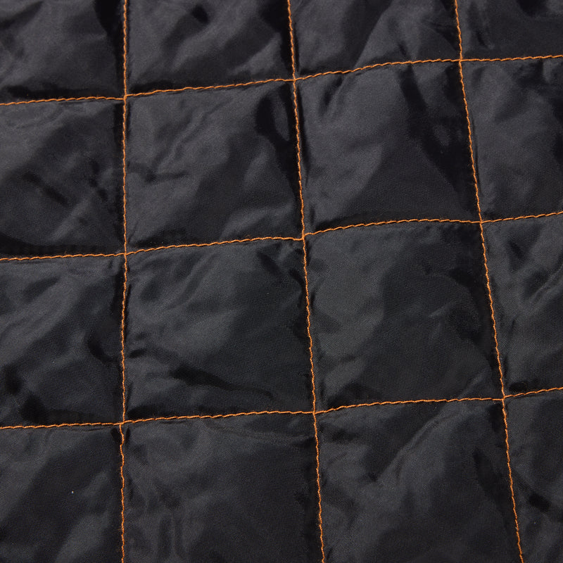 Close-up of the Drake Campfire Canvas Shirt Jac Hoodie's quilted interior, showcasing its orange-stitched insulation designed for warmth and comfort.