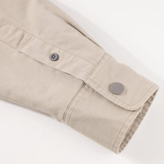 Close-up of the Campfire Canvas Shirt Jac Hoodie, highlighting buttoned cuff and placket, showcasing durable craftsmanship ideal for outdoor comfort and style.