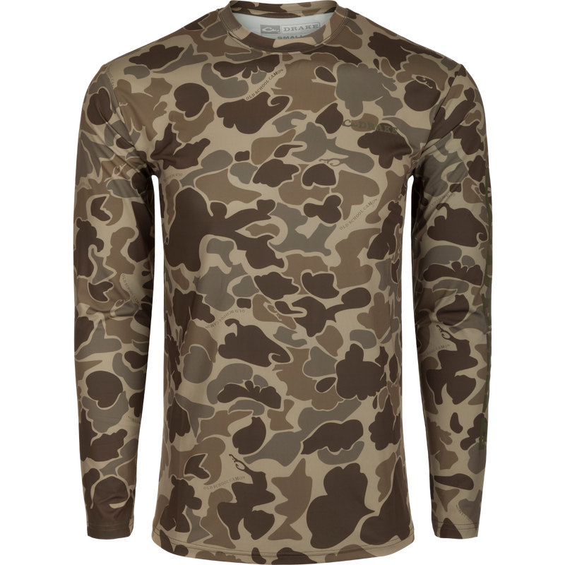 Drake Long Sleeve Performance Crew with advanced features like UPF 50 and moisture-wicking, ideal for versatile outdoor activities in various weather conditions.
