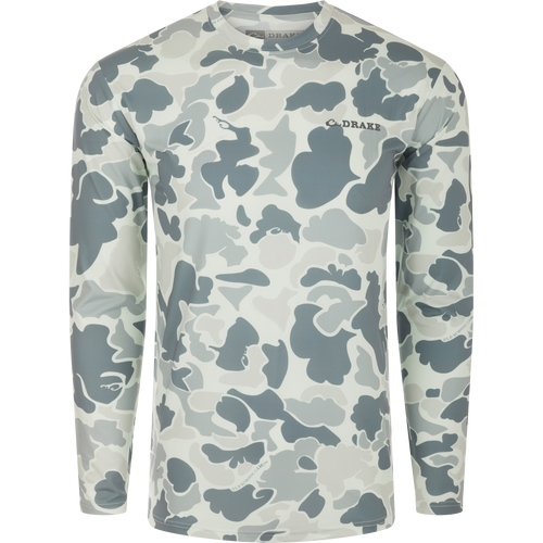 Drake Long Sleeve Performance Crew with built-in cooling, UPF 50, and quick-dry features, ideal for year-round wear in various outdoor activities.