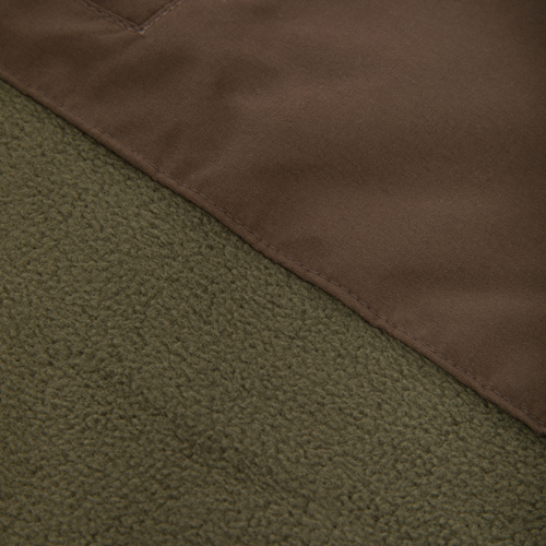 Close-up of the Drake Eqwader Vest, showcasing its waterproof upper with Magnattach™ pocket and breathable fleece lower, ideal for hunting versatility.