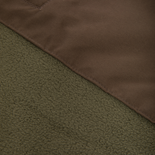 Close-up of the Drake Eqwader Vest, showcasing its waterproof upper with Magnattach™ pocket and breathable fleece lower, ideal for hunting versatility.