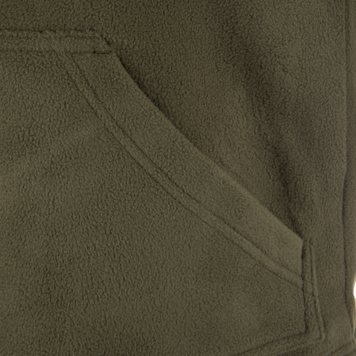 Close-up of the Drake Eqwader Vest showcasing fleece fabric, vertical zippered chest pockets, and durable waterproof material designed for hunting and outdoor activities.