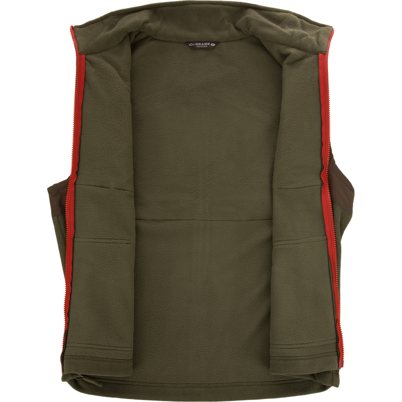 Eqwader Vest with red trim and zipper, featuring Magnattach™ chest pockets, waterproof shoulders, and breathable fleece lower torso, ideal for hunting and outdoor activities.
