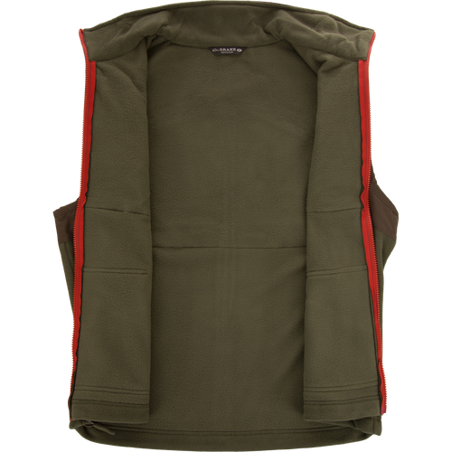 Eqwader Vest with red trim and zipper, featuring Magnattach™ chest pockets, waterproof shoulders, and breathable fleece lower torso, ideal for hunting and outdoor activities.