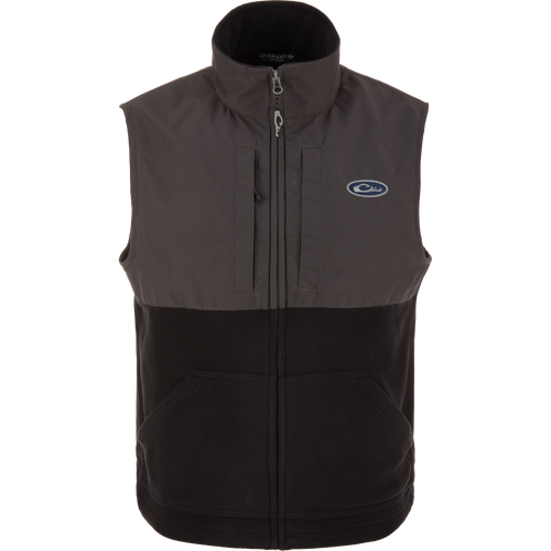 Eqwader Vest close-up showcasing mid-layer insulation, waterproof shoulders, breathable fleece lower torso, and secure chest pockets for valuables. Perfect for hunting and outdoor activities.
