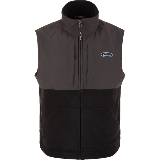 Eqwader Vest close-up showcasing mid-layer insulation, waterproof shoulders, breathable fleece lower torso, and secure chest pockets for valuables. Perfect for hunting and outdoor activities.