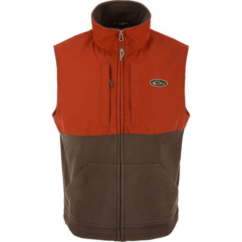 Eqwader Vest close-up, highlighting mid-layer insulation, waterproof shoulders, and breathable fleece lower torso, featuring chest pockets for secure storage.
