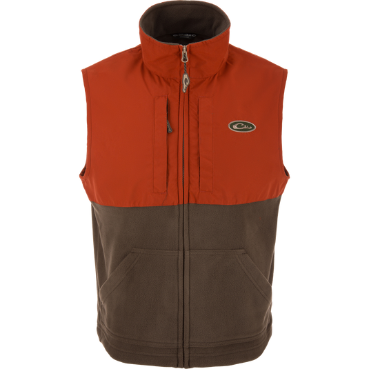 Eqwader Vest close-up, highlighting mid-layer insulation, waterproof shoulders, and breathable fleece lower torso, featuring chest pockets for secure storage.