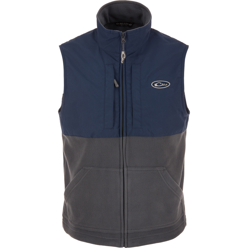 Eqwader Vest featuring mid-layer insulation and waterproof shoulders, with Magnattach™ and zippered chest pockets, designed for optimal movement and breathability in hunting environments.