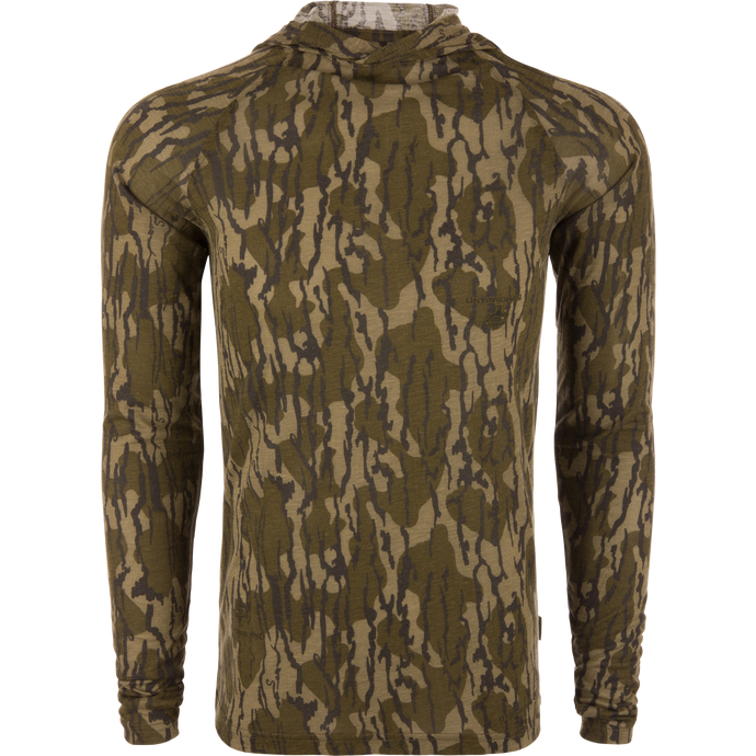Hunter Creek Bamboo Long Sleeve Hoodie on mannequin, showcasing form-fitting design with woodland camo print, emphasizing lightweight, breathable fabric, and built-in hood for sun protection.
