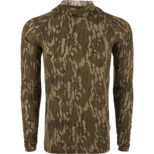 Hunter Creek Bamboo Long Sleeve Hoodie on mannequin, showcasing form-fitting design with woodland camo print, emphasizing lightweight, breathable fabric, and built-in hood for sun protection.