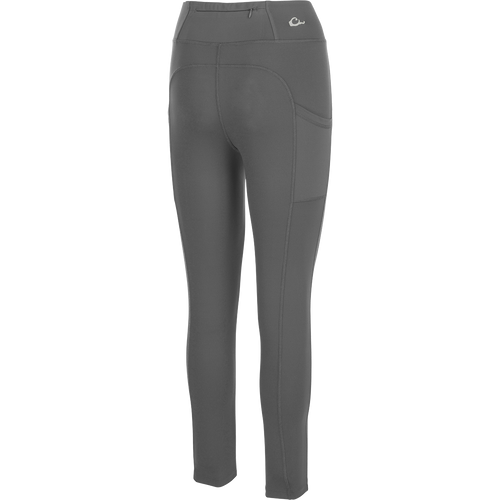 Women's Commando Solid Legging, a versatile high-performance legging with 4-way stretch fabric. Features include a 4-inch waistband, back zippered pocket, and angled side seam pockets. Quick drying and moisture-wicking for your next adventure.
