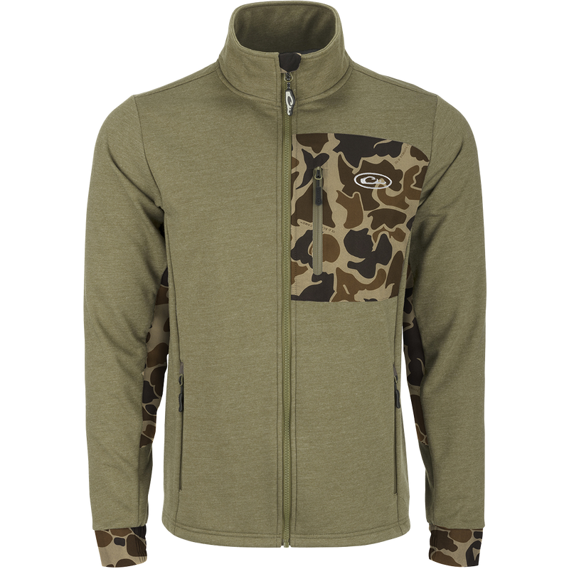 Close-up of the Drake Hybrid Windproof Jacket showcasing the giraffe print, camouflage pattern, and functional welded chest pocket, emphasizing its windproof and insulated design for versatile use.