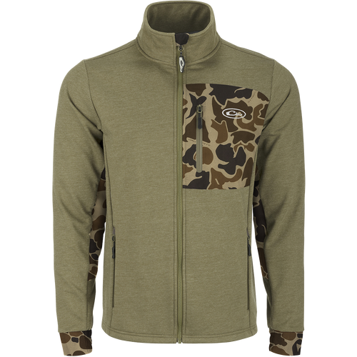 Close-up of the Drake Hybrid Windproof Jacket showcasing the giraffe print, camouflage pattern, and functional welded chest pocket, emphasizing its windproof and insulated design for versatile use.