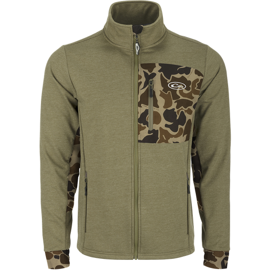 Close-up of the Drake Hybrid Windproof Jacket showcasing the giraffe print, camouflage pattern, and functional welded chest pocket, emphasizing its windproof and insulated design for versatile use.