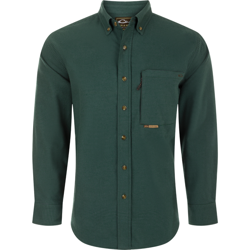A midweight, long-sleeved shirt made from 100% brushed cotton twill. Features a button-down collar, back box pleat, and chest pockets. Perfect for cool weather.
