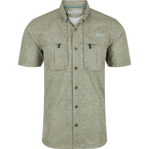 Heritage Heather Shirt S/S: A performance shirt with micro mesh fabric for natural cooling, UPF30 sun protection, and moisture-wicking properties. Features include a hidden button-down collar, vented cape back, and two chest pockets. Perfect for outdoor activities or the office.