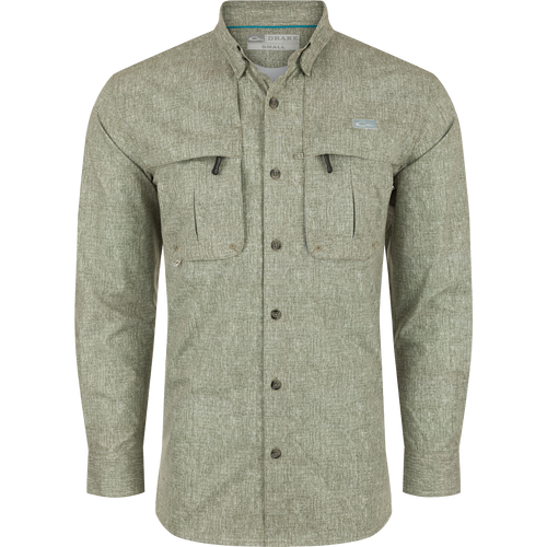 A Drake Heritage Heather Shirt L/S, a long-sleeved shirt with pockets. Made of 100% polyester micro mesh for natural cooling, moisture-wicking, and quick-drying. Features include a hidden button-down collar, vented cape back, and two front chest pockets. Perfect for performance on the water or at the office.